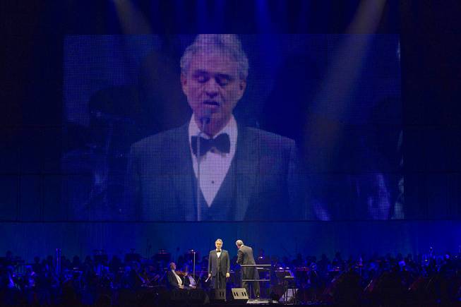 A live image of Italian-born tenor Andrea Bocelli is shown on a video screen as he performs with conductor Eugene Kohn at MGM Grand Garden Arena on Saturday, Dec. 7, 2013.