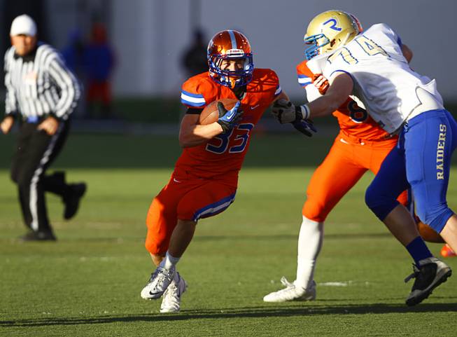 Bishop Gorman High School's Jonathan Shumaker (33) carries the ball during their Division I state high school football championship game against Reed High School of Sparks, Nev. at Sam Boyd Stadium Saturday, Dec. 7, 2013.