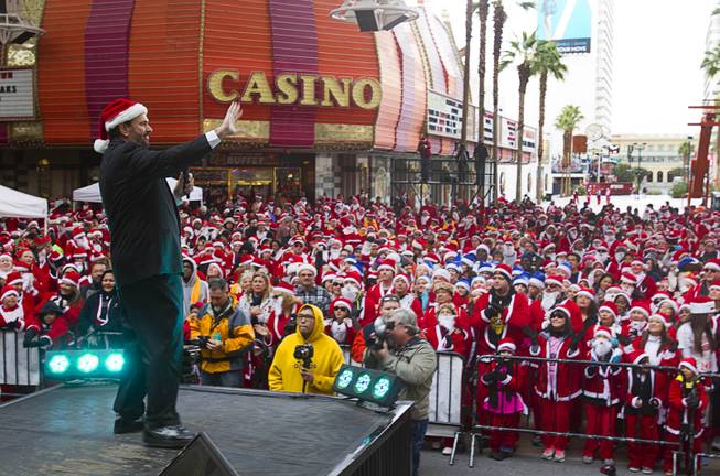 George Dare performs on the Third Street stage during the annual Las Vegas Great Santa Run in downtown Las Vegas Saturday, Dec. 7, 2013. Officials said 11, 201 people participated in the event. Proceeds from the event benefit Opportunity Village, an organization that serves people with intellectual disabilities.
