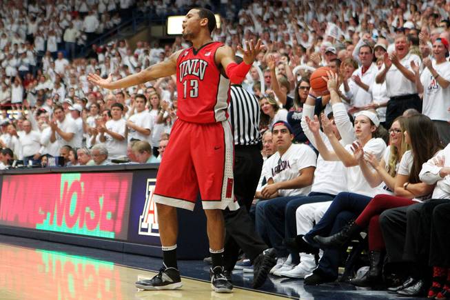 UNLV guard Bryce Dejan Jones reacts after teammate Deville Smith's pass went wide and into the seats of the McKale Center late in their game against Arizona Saturday, Dec. 7, 2013. Arizona won the game 63-58.