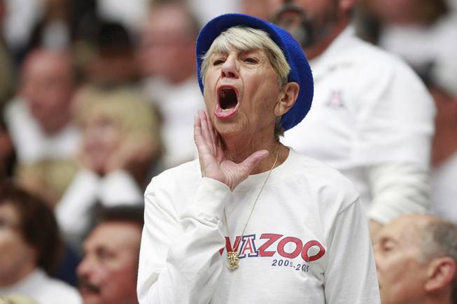 An Arizona fan yells her disapproval about a call during their game against UNLV at the McKale Center in Tucson Saturday, Dec. 7, 2013. Arizona won the game 63-58.