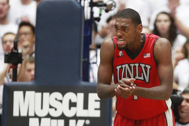 UNLV forward Roscoe Smith gets animated during the first half of their game against Arizona at the McKale Center in Tucson Saturday, Dec. 7, 2013. Arizona won the game 63-58.