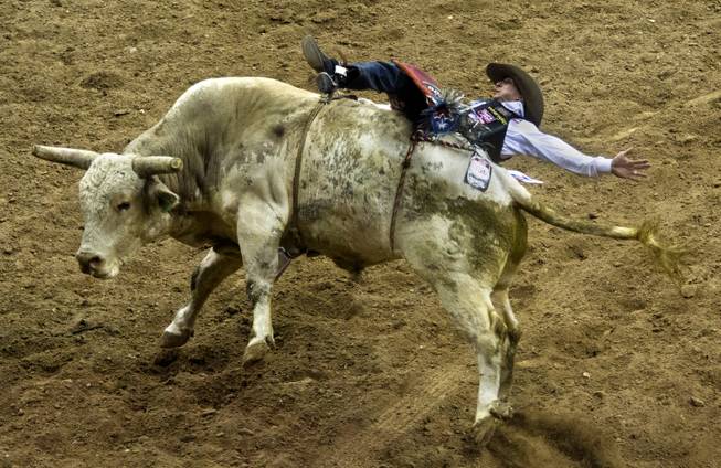 Bull Rider J.W. Harris is bucked off a bull during the Wrangler National Finals Rodeo Go-Round Day 3 at the Thomas & Mack Center in Las Vegas, Nevada, on Saturday,  Dec. 7, 2013.