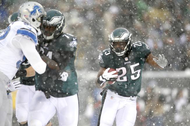 Philadelphia Eagles running back LeSean McCoy runs with the ball during the second half of an NFL football game against the Detroit Lions on Sunday, Dec. 8, 2013, in Philadelphia. 