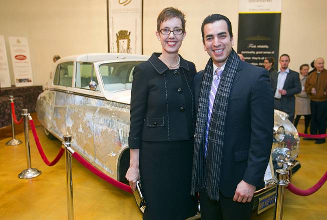 Nevada Assemblywoman Heidi Swank and State Sen. Ruben Kihuen pose in front of a 1961 Phantom V Rolls Royce that was owned by Liberace during an open house and book signing at the Liberace house Monday, Dec. 9, 2013. Swank is executive director of the Nevada Preservation Foundation. Liberace's former residence was purchased by British businessman Martyn J. Ravenhill for $500,000 in August.