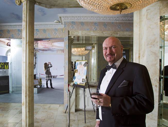 British businessman Martyn J. Ravenhill hosts an open house and book signing at the Liberace house Monday, Dec. 9, 2013. Ravenhill purchased Liberace's former residence for $500,000 in August. He also recently published a book titled "The Social Stockmarket."