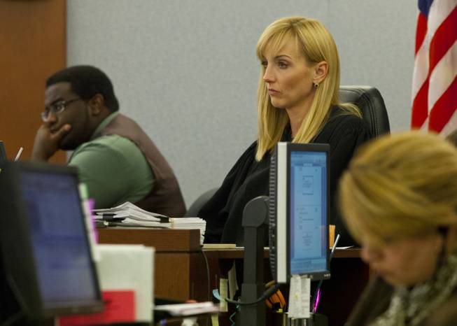 Clark County District Court Judge Stefany Miley looks on as prosecuting attorney Bruce Nelson argues the sentence for Jvon Williams on Monday,  Dec. 9, 2013.