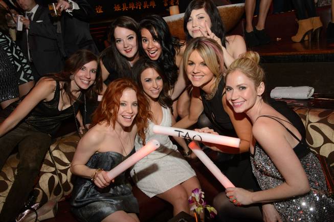 Lacey Chabert (in white), Ali Fedotowsky (second from right) and friends at Tao on Saturday, Dec. 7, 2013, in the Venetian.