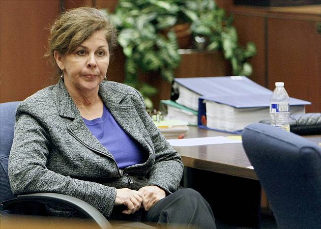 Former assistant city manager of Bell, Calif., Angela Spaccia, who is charged with misappropriation of public funds and other counts, listens to opening statements in Los Angeles Superior Court, Oct. 23, 2013. 
