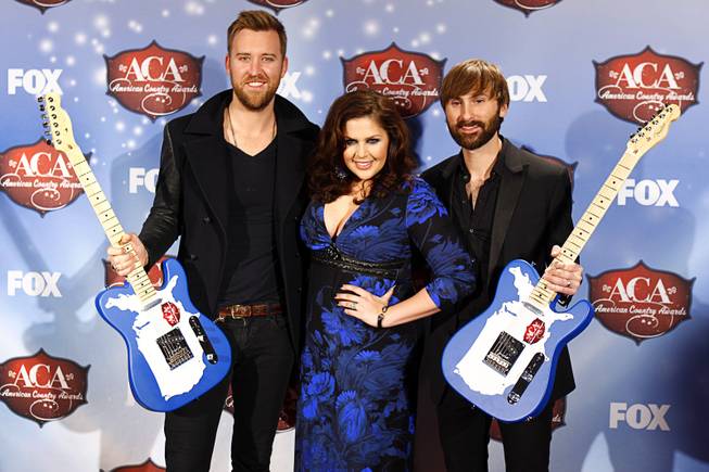 Charles Kelley, Hillary Scott and Dave Haywood of Lady Antebellum stand with their awards during the 4th annual American Country Awards at Mandalay Bay Events Center on Tuesday, Dec. 9, 2013.