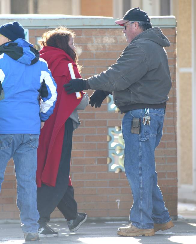 A group of six people arrive at Pershing General Hospital after being lost for two days in the frigid mountains near Lovelock, Nev., Tuesday, Dec. 10, 2013.