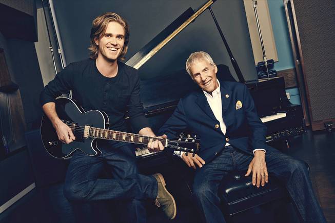 A publicity photo for the new musical “What’s It All About? Bacharach Reimagined" shows co-conceiver Karl Riabko, left, and composer Burt Bacharach. The show is performing off-Broadway at New York Theatre Workshop in New York. 