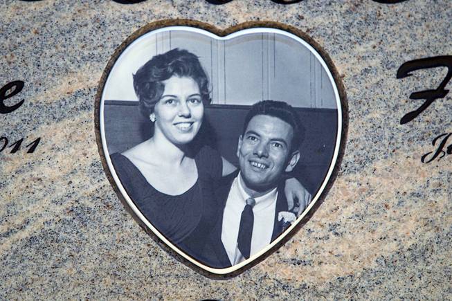A photo is shown on Sandra Lee Bower's marker at Palm Boulder Highway Mortuary & Cemetery in Henderson Wednesday, Dec. 11, 2013. The photo shows Sandra Lee and Frank Bower after their marriage in 1959. After Sandra Lee died in 2011, Frank had a portion of her ashes sent into space.