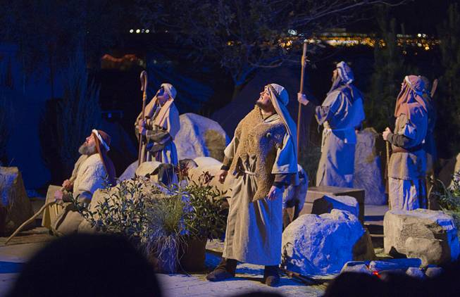 Townspeople listen to the sining of angels after the birth of Jesus Christ during the Nativity, a live nativity performance, at Opportunity Village Englestad Campus, 6050 S. Buffalo Drive, Wednesday, Dec. 11, 2013. The free performances are at 6 p.m. and 7 p.m. on Thursday with the 7 p.m. show in Spanish. On Friday and Saturday there is an additional performance at 8 p.m. The production is put on by the Red Rock Stake of the Church of Latter-day Saints.