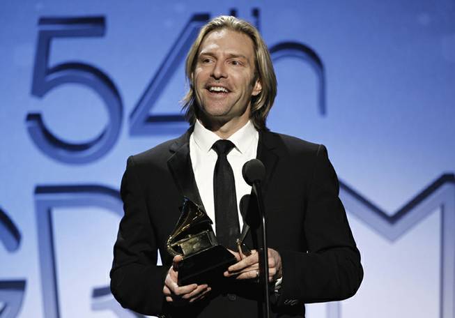 Eric Whitacre accepts the award for choral performance at the 54th annual GRAMMY Awards pre-show on Sunday, Feb. 12, 2012 in Los Angeles. 