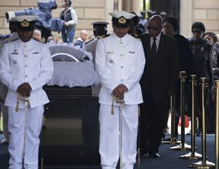 South African President Jacob Zuma pays his respects to former South African President Nelson Mandela during the lying in state at the Union Buildings in Pretoria, South Africa, Wednesday, Dec. 11, 2013. 