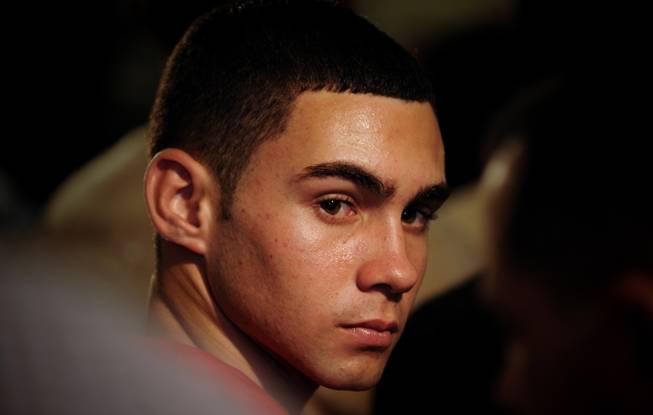 In this June 30, 2010, file photo, Elian Gonzalez attends an official event with Cuba's President Raul Castro in Havana, Cuba.