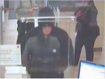 Henderson Police say this man, cloaked in a hoodie, is a suspect in the robbery of the Wells Fargo bank branch at 1411 W. Sunset Road on Saturday, Dec. 7, 2013.