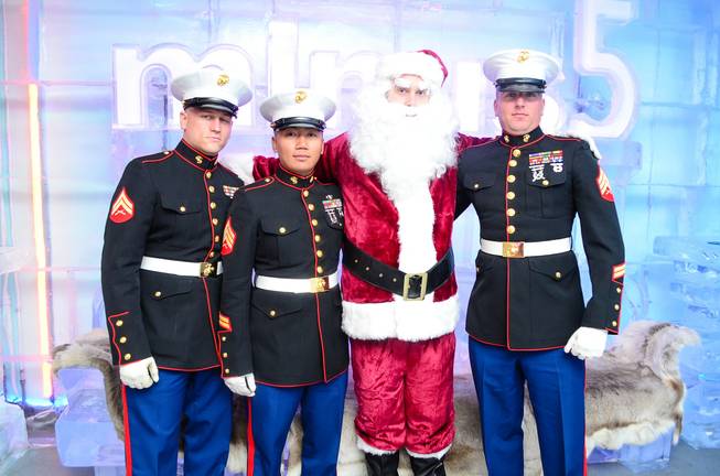 Marine Cpl. Baker, Sgt. Yommalat, Santa Claus and Sgt. Ringgold at the Toys for Tots drive at Minus 5 Ice Bar in Mandalay Place.