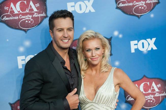 Luke Bryan and his wife, Caroline, arrive at the 2013 ...
