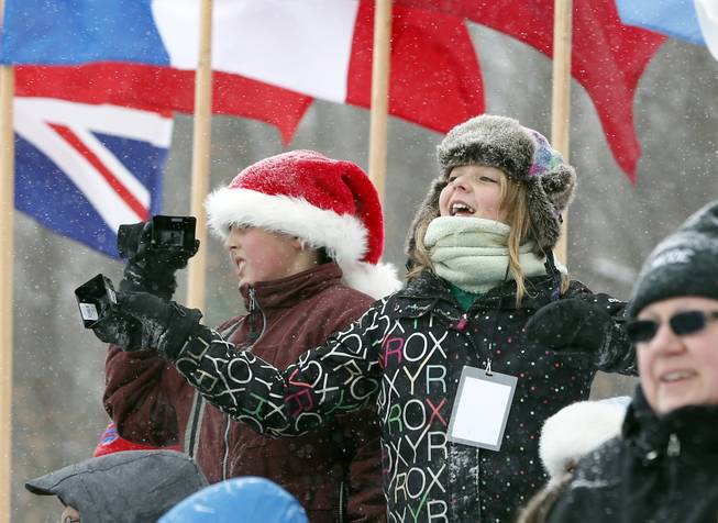 Fans cheer on athletes during the two-man bobsled World Cup event on Friday, Dec. 13, 2013, in Lake Placid, N.Y. 