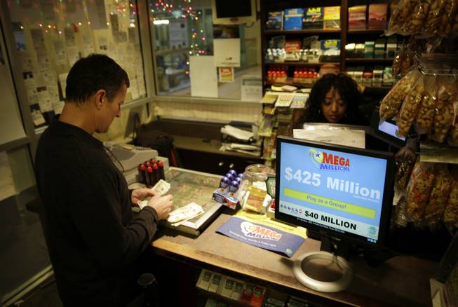 Chad Cuneo counts out his money for his to buy Mega Millions lottery tickets at a newsstand Friday, Dec. 13, 2013, in Philadelphia. Superstition didn't deter players hoping that Friday the 13th will bring them good luck in the Mega Millions game as heavy sales prompted lottery officials to boost the estimated jackpot to $425 million.