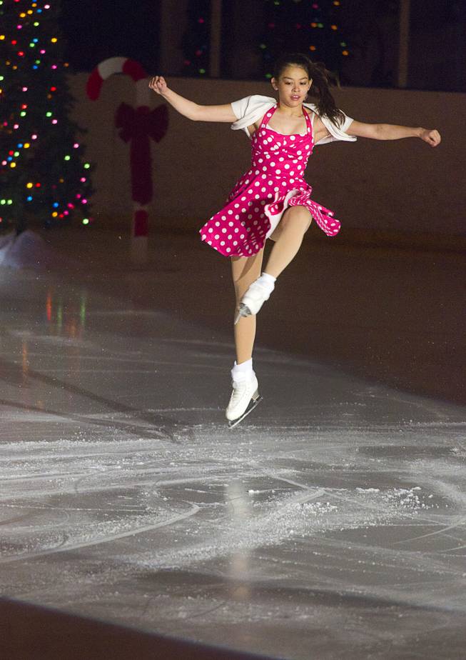 Marissa Becker jumps during "Treasure of Christmas" holiday ice show at the Sobe Ice Arena at the Fiesta Rancho Sunday, Dec. 15, 2013. The annual program features local skaters. Admission was free with a donation of three canned goods which will be donated to the Salvation Army, organizers said.