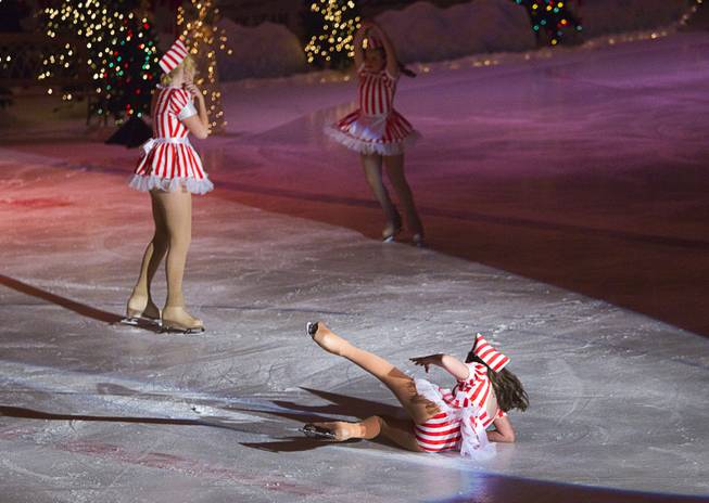 A skater falls during "Treasure of Christmas" holiday ice show at the Sobe Ice Arena at the Fiesta Rancho Sunday, Dec. 15, 2013. The annual program features local skaters. Admission was free with a donation of three canned goods which will be donated to the Salvation Army, organizers said.