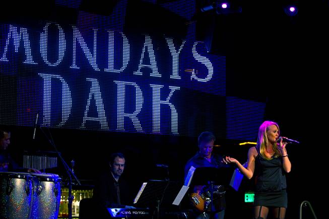 Carrie St. Louis performs during "Monday's Dark" with Mark Shunock, a monthly charitable event, at Body English nightclub at the Hard Rock Hotel Monday Dec. 16, 2013. Proceeds from the event benefited local nonprofit Aid for Aids of Nevada (AFAN).