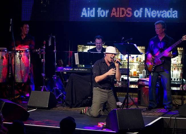 Martin Kaye performs during "Monday's Dark" with Mark Shunock, a monthly charitable event, at Body English nightclub at the Hard Rock Hotel Monday Dec. 16, 2013. Proceeds from the event benefited local nonprofit Aid for Aids of Nevada (AFAN).
