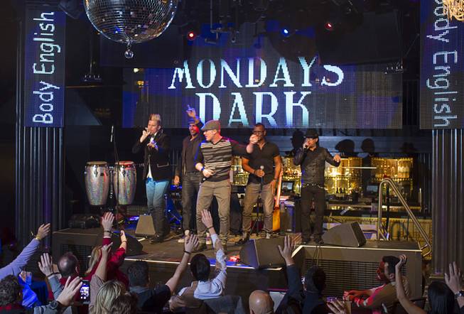 Members of Mo5aic perform during "Monday's Dark" with Mark Shunock, a monthly charitable event, at Body English nightclub at the Hard Rock Hotel Monday Dec. 16, 2013. Proceeds from the event benefited local nonprofit Aid for Aids of Nevada (AFAN).