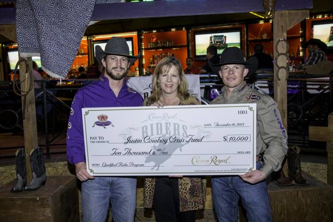 Crown Royal riders donate $10,000 to the Justin Cowboy Crisis Fund on Saturday, Dec. 14, 2013. 