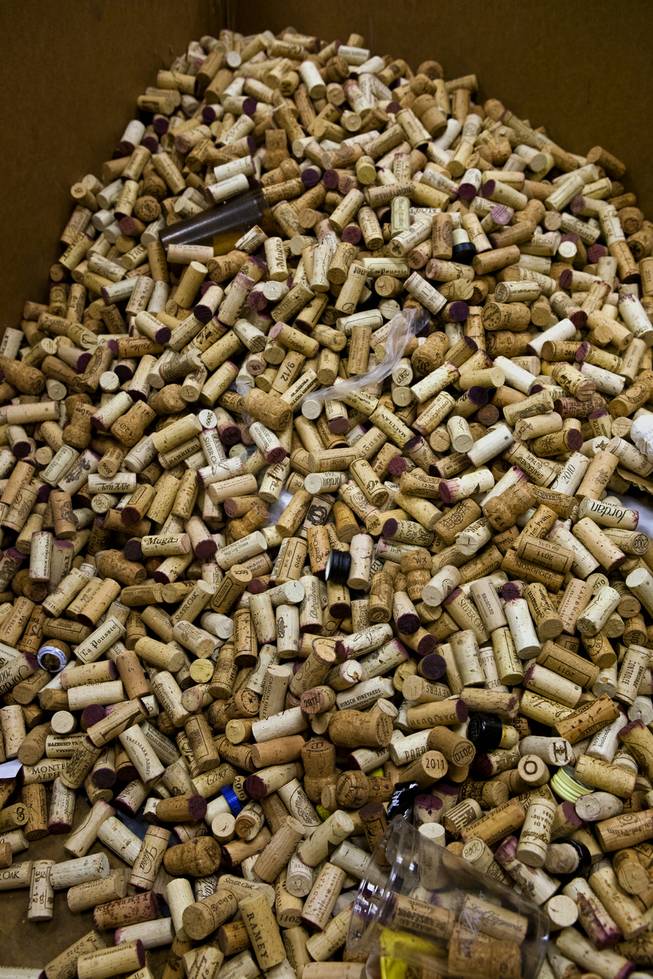 Even corks are gathered into a bin at a Bellagio, one of many items sorted there as part of their recycling efforts Tuesday, Dec. 17, 2013.
