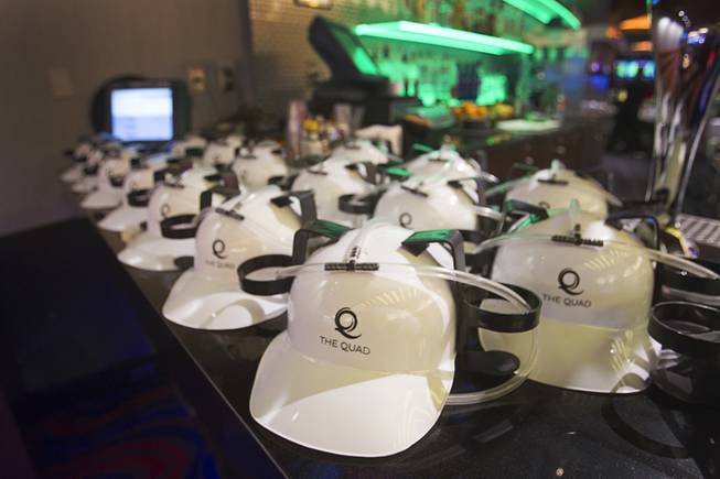 Hard hats with holders for drinks are displayed in the Quad before a hard hat tour of the new O'Sheas casino Tuesday Dec. 18, 2013. The casino is scheduled to open Dec. 27.