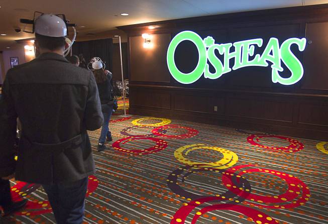 Journalists head into the new O'Sheas casino Tuesday Dec. 18, 2013. The casino is scheduled to open Dec. 27 and can be accessed from the Quad or from the Linq.