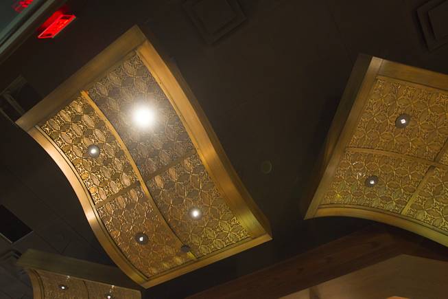 Light fixtures are shown during a hard hat tour of the new O'Sheas casino Tuesday Dec. 18, 2013. The fixtures include repurposed ceiling panels from the original O'Sheas. The casino is scheduled to open Dec. 27.
