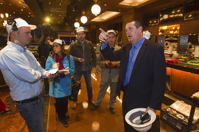 Shawn Ritchie, right, vice president of food and beverage for the Flamingo and the Quad, talks with reporters during a hard hat tour of the new O'Sheas casino Tuesday Dec. 18, 2013. The casino is scheduled to open Dec. 27.
