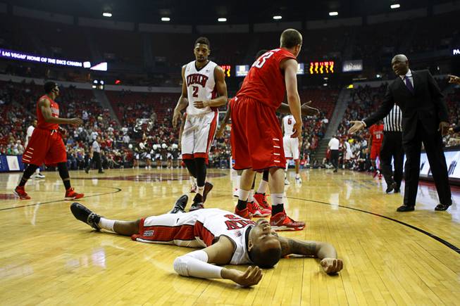 UNLV Runnin' Rebels Bryce Dejean-Jones lies on the court after a turnover during the first game of the Continental Tire Las Vegas Classic against the Radford University Highlanders at the Thomas & Mack Center Wednesday, Dec. 18, 2013.