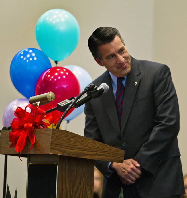 Gov. Brian Sandoval talks about the importance of education to students and invited guests at the Northwest Career & Technical Academy for the Nevada Teacher of the Year Award ceremony on Wednesday, Dec. 18, 2013.