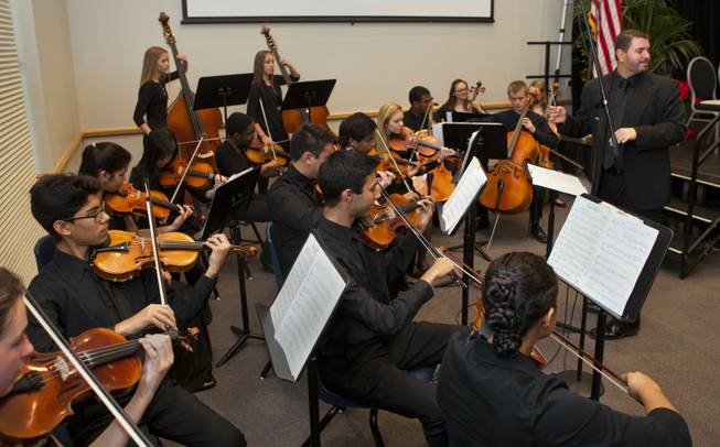 The Northwest Career & Technical Academy orchestra plays as teacher Jeff Hinton steps up to receive the Nevada Teacher of the Year Award on Wednesday, Dec. 18, 2013.