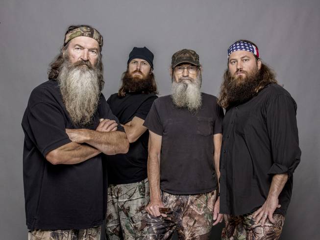 This 2012 photo released by A&E shows Phil Robertson, Jase Robertson, Si Robertson and Willie Robertson from the A&E series "Duck Dynasty."