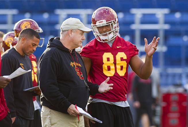 USC tight end and Bishop Gorman graduate Xavier Grimble, right, talks with special teams and tight end coach John Baxter during practice with the team at Bishop Gorman Thursday, Dec. 19, 2013. USC plays Fresno State in Saturday's Las Vegas Bowl.