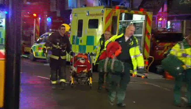 This image taken from television shows emergency services evacuating  a person on a stretcher following an incident at the Apollo Theatre, in London's Shaftesbury Avenue, Thursday evening, Dec. 19, 2013, during a performance at the height of the Christmas season, with police saying there were "a number" of casualties. 