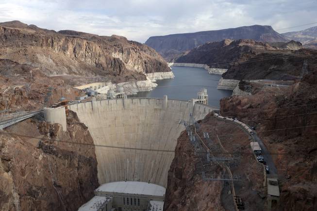 A view of Hoover Dam and Lake Mead shows canyon walls ringed with white mineral deposits indicating the drop in water levels, near Boulder City, Nev., Dec. 18, 2013.