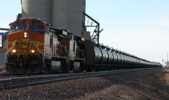 A BNSF Railway train hauls crude oil west of Wolf Point, Mont. As common as the mile-long trains have become across the U.S. and Canada, dozens of officials in the towns and cities where they travel say they are concerned they are not adequately prepared to handle an emergency, whether it is a derailment, a large spill or an explosion like those in Canada in July or another in Alabama in November. Railroad officials say that despite the high-profile accidents, transporting oil by trains is safe and that they also have crews stationed around the country to respond to emergencies.