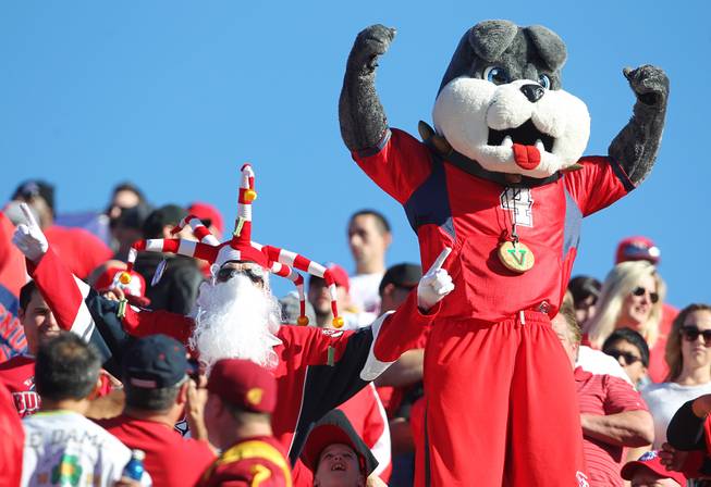 The Fresno State bulldog cheers with fans during the Royal Purple Las Vegas Bowl game against USC Saturday, Dec. 21, 2013 at Sam Boyd Stadium.