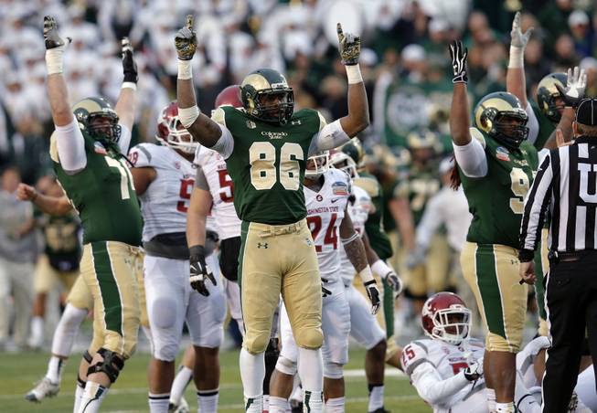 Colorado State tight end Kivon Cartwright (86) celebrates with teammates as the game-winning field goal is made against Washington State in the NCAA New Mexico Bowl college football game Saturday, Dec. 21, 2013, in Albuquerque, N.M. Colorado State won 48-45.