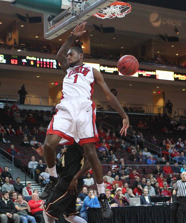 UNLV forward Roscoe Smith dunks on Santa Clara during their Continental Tire Las Vegas Classic game Sunday, Dec. 2013, at the Orleans Arena. UNLV won 92-71 and will face Mississippi State in the championship game Monday night.