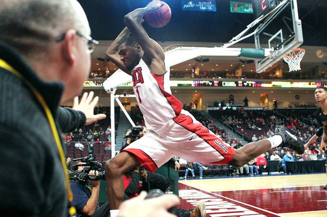 UNLV forward Roscoe Smith tries to keep the ball from going out of bounds during their Continental Tire Las Vegas Classic game against Santa Clara Sunday, Dec. 2013, at the Orleans Arena. UNLV won 92-71 and will face Mississippi State in the championship game Monday night.