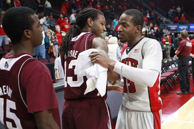 UNLV guard Deville Smith greets former Mississippi State teammate Tevin Moore after their Continental Tire Las Vegas Classic championship game Monday, Dec. 23 2013, at the Orleans Arena. UNLV won the game 82-66.